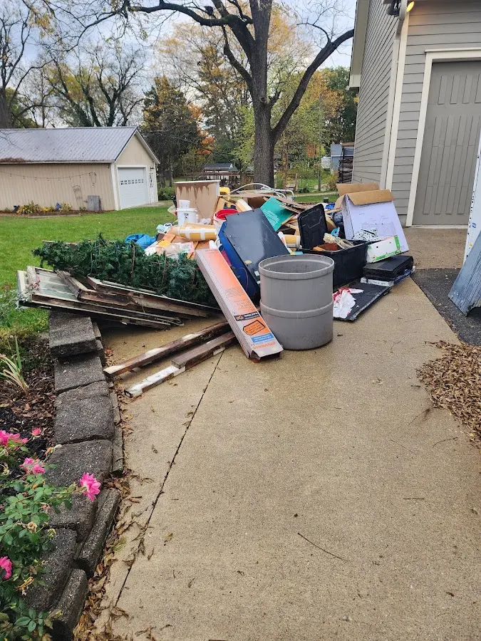 Dumpster being loaded with debris for Roofing Dumpster Rental in Barberton